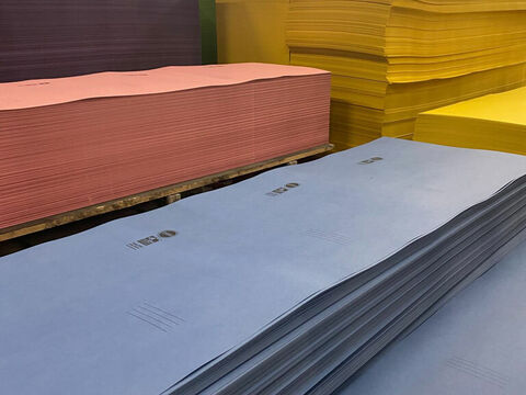 Stacked red blue yellow paper 768 576